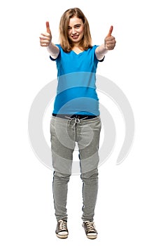 Happy young woman giving a double thumbs up