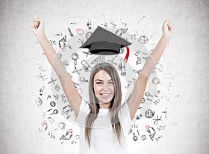 Happy young woman with hands in the air, education