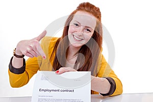 Happy young woman is happy about her employment contract