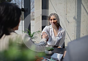 Happy young woman having job interview in office, business and career concept.