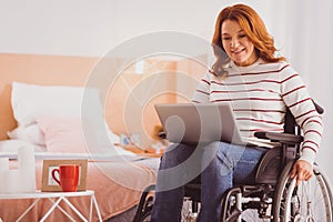 Happy young woman having video conference