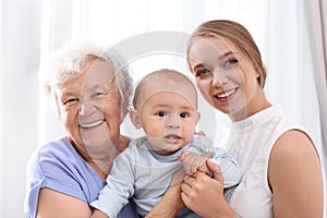 Happy young woman with her child and grandmother
