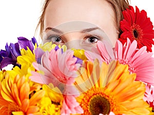 Happy young woman holding flowers.