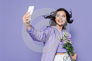 happy young woman holding flowers and