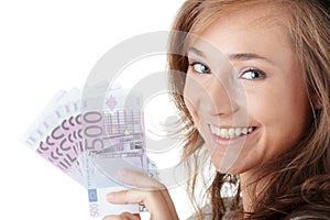 Happy young woman holding money