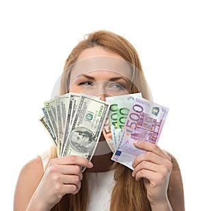 Happy young woman holding up cash money compare euro dollars