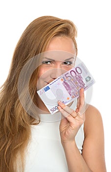 Happy young woman holding up cash money five hundred euro