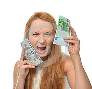 Happy young woman holding up cash money one hundred euro and dollars
