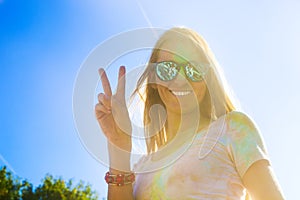 Happy young woman on holi color festival