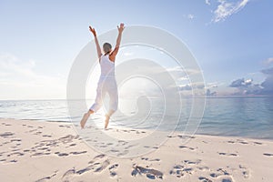 Happy young woman jumping