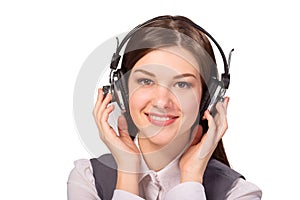 Happy young woman listening to music via headphones