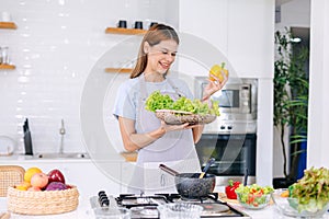 Happy Young Woman Making Salad. People Eating Healthy Food. Vegan Lady In Kitchen Home. Eat Vegetable For Dieting. Prepare Diet