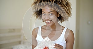 Happy Young Woman Open Gift Box In Bedroom