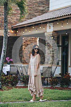 Happy young woman in outdoor cafe at summer day. Warm evening and happy woman on vacation