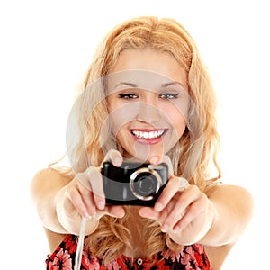 Happy young woman photographer doing photos with still camera