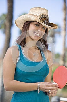 Happy Young Woman Playing Table Tennis