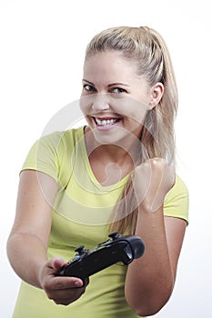 Happy young woman playing video game with joystick