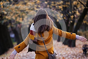 Happy young woman portrait in autumn park