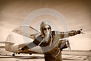 Happy young woman with raised hands flying on airporte,