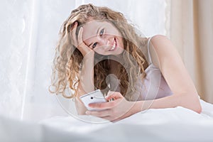 Happy young woman receiving message