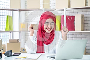 Happy young woman after receiving orders from customers, Muslim woman business owner working from home, entrepreneurs online s