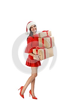 Happy young woman in Santa hat with Christmas gifts