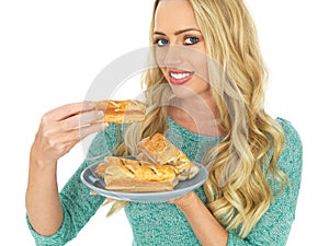 Happy Young Woman With Sausage Rolls