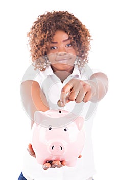 Happy Young Woman Saves Money in Piggy bank