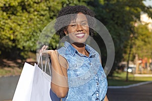 Happy young woman during shopping