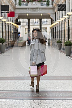 Happy young woman with shopping bags