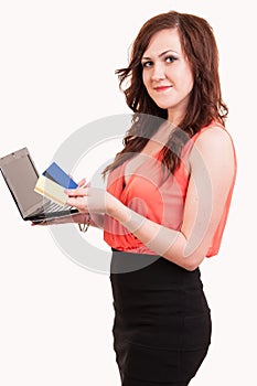 Happy young woman shopping online with credit card and laptop