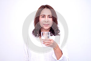 Happy young woman showing drinking glass