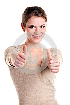 Happy young woman showing thumb up sign
