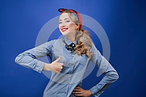 Happy young woman showing thumbs up
