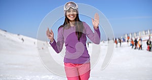 Happy young woman at a ski resort