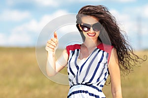 Happy young woman smiling to the camera