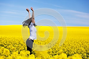 Happy young woman on spring field. Success