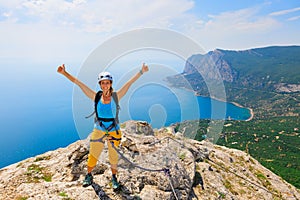 Happy young woman stand on mount top