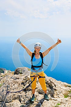 Happy young woman stand on mount top