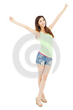 Happy young woman student standing and raise arms