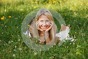 Happy young woman on a summer flower meadow outdoor