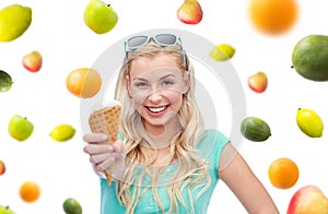 Happy young woman in sunglasses eating ice cream