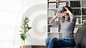 Happy young woman surprised in VR headset, feeling air. Smiling caucasian woman wearing vr glasses,