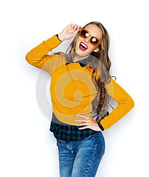 Happy young woman or teen girl in casual clothes