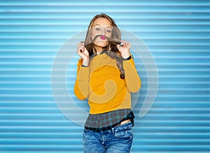 Happy young woman or teen girl in casual clothes