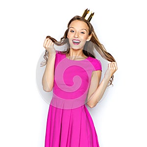 Happy young woman or teen girl in pink dress