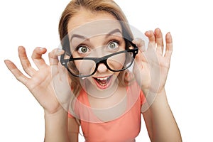 Happy young woman or teenage girl in eyeglasses