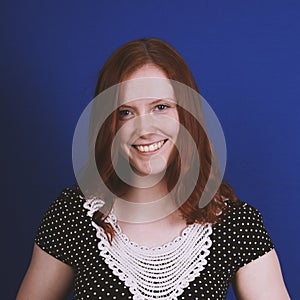 Happy young woman with toothy smile photo
