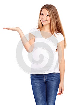 Happy young woman in tshirt showing empty copyspace