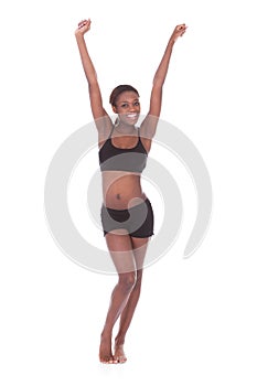 Happy young woman in undergarments celebrating success